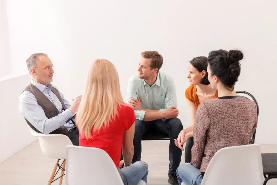 a group of people attending counseling for addiction